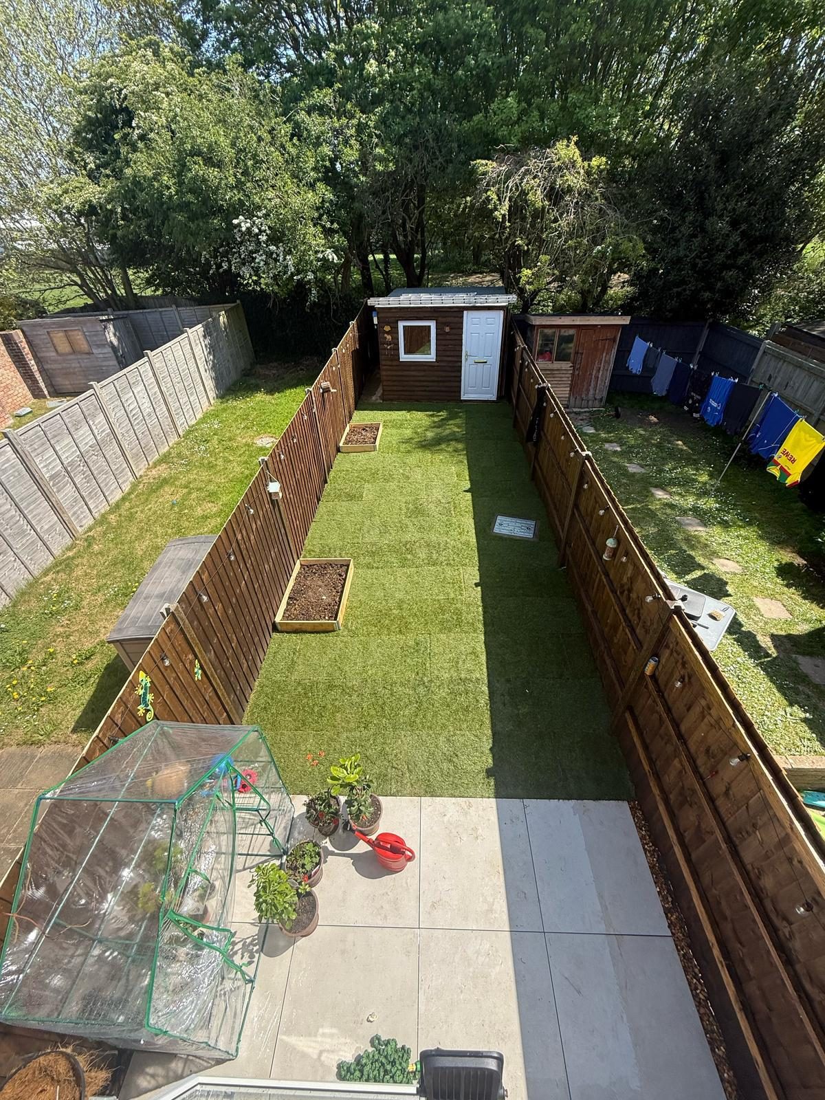 Finished garden viewed from above with turf and patio