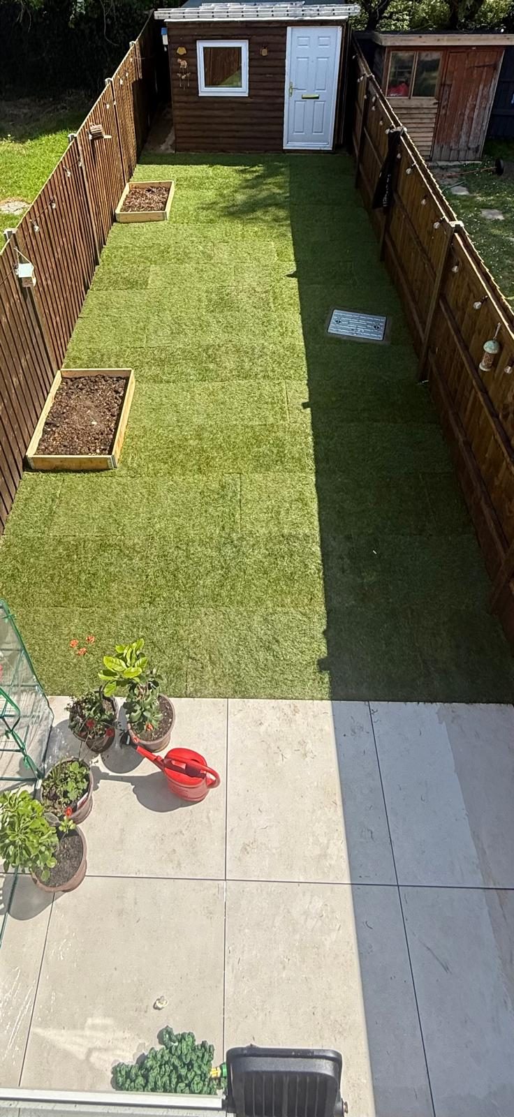 Finished garden with new turf and planters