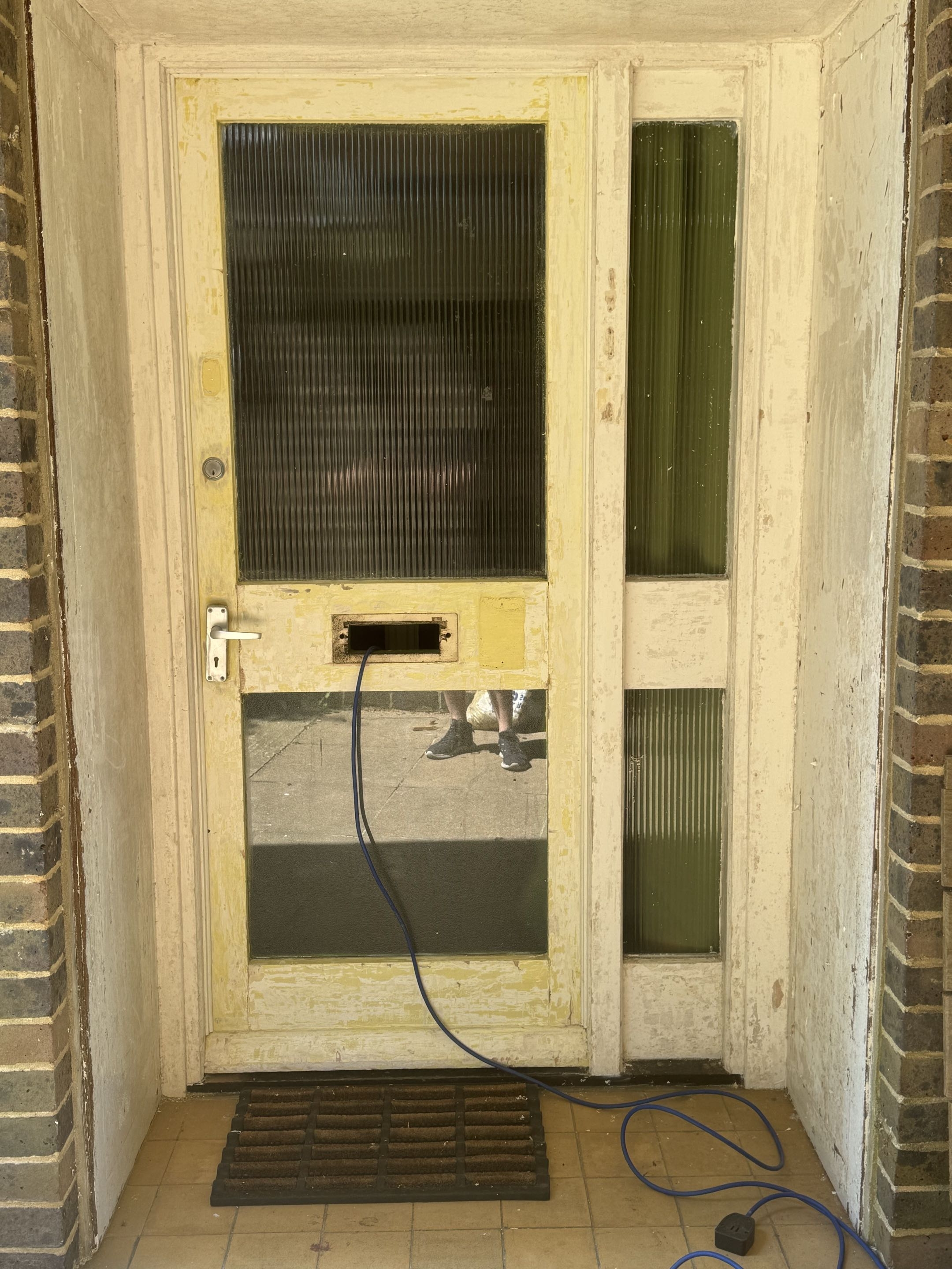 Front door and entrance surround before repainting