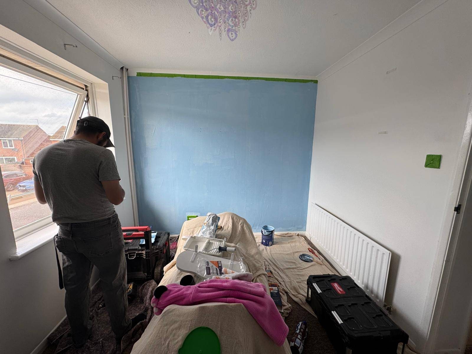 Interior room painting with blue feature wall