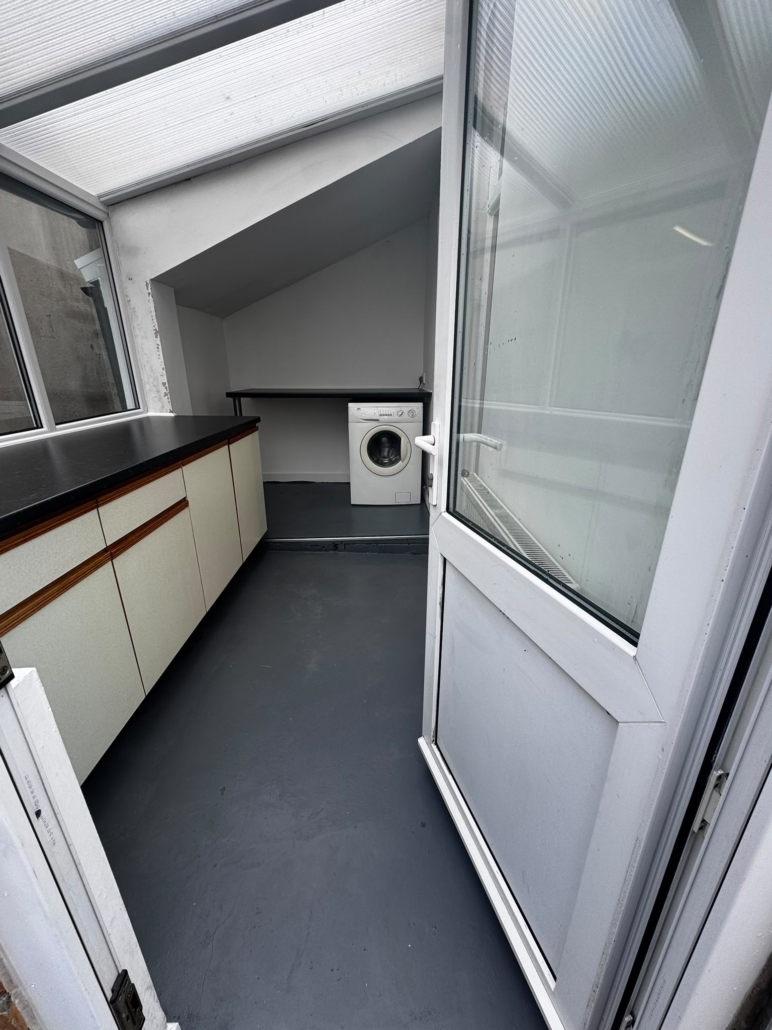 Utility room after renovation with worktop storage and fresh grey painted floor